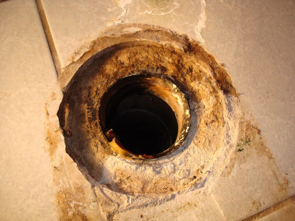 part of flange stuck in waste pipe.